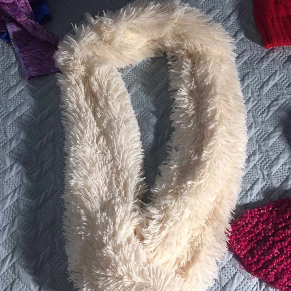 cream scarf, pink scarf and red beanie